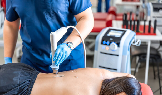Extracorporeal shockwave therapy, physical therapy for neck and back muscles.