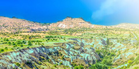 Bizarre rock formations of volcanic Tuff and basalt on soft sunlight in Cappadocia, Turkey