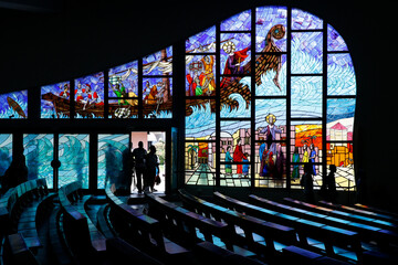 Saint Paul's catholic cathedral, Abidjan, Ivory Coast. Pews and stained glass.