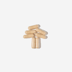 Mushroom supplement pills. Minimal flat lay.