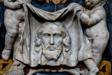 Baroque reliefs in SS. Salvatore (Saviour) church, Palermo, Sicily, Italy. Angels holding the veil of Veronica