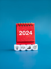 Happy new year 2024 vertical banner background. 2024 numbers on red small desk calendar cover...