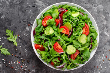 Healthy Vegetable Salad with Tomatoes, Arugula, Cucumbers and Onion, Diet Menu, Bright Background