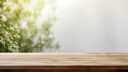 Wooden table with white flowers side against a blurred sunlight and green tree background. High quality photo