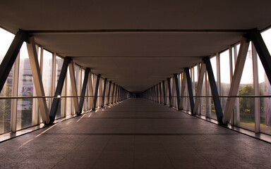 Indoor bridge at sunset leading to nowhere