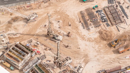 Aerial view construction site with a foundation pit of new skyscraper timelapse.