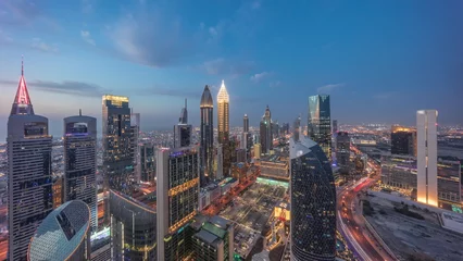 Foto op Canvas Skyline view of the high-rise buildings on Sheikh Zayed Road in Dubai aerial day to night timelapse, UAE. © neiezhmakov