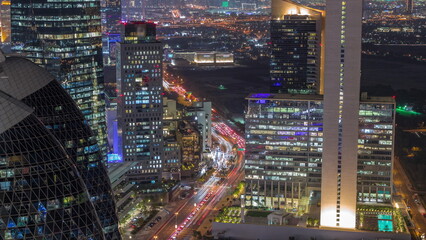Skyline view of the high-rise buildings in International Financial Centre in Dubai aerial night timelapse, UAE.