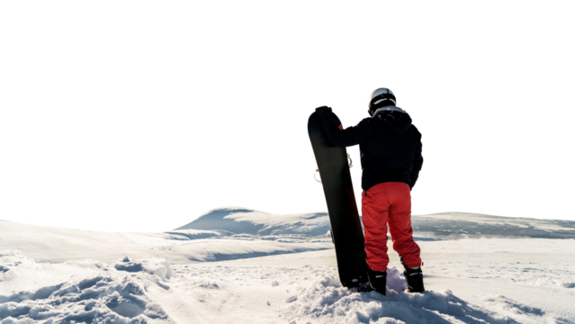Male rear view snowboarder in sportswear for winter sports. Keeps a snowboard for holidays. - Powered by Adobe