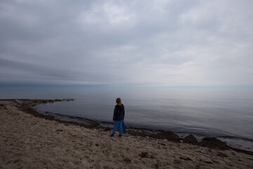 girl at cloudy beach (Baltic Sea)