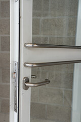 Plastic pvc door at the home. Transparent glass door . Door with aluminum frame and stainless steel holder. © Cardinal 