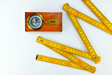 Folding ruler and leveler compass on white background