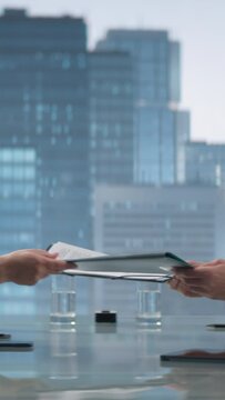 Vertical Screen: Close Up Of Female and Male Business Partners Sign Successful Deal and Shake Hands in Meeting Room in Skyscraper Office. CEO and Financial Analyst Handshake on Financial Opportunity.