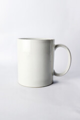 an empty ceramic white cup  isolated on white background.