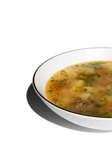 homemade soup with potatoes, meatballs, parsley in a white plate