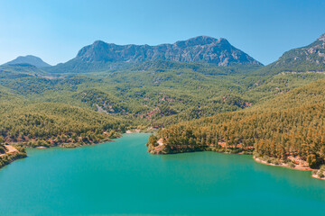 Aerial view of National Park plateau, high rock. Wooden Lake reservoir forest among rocky mountains and peaks.
