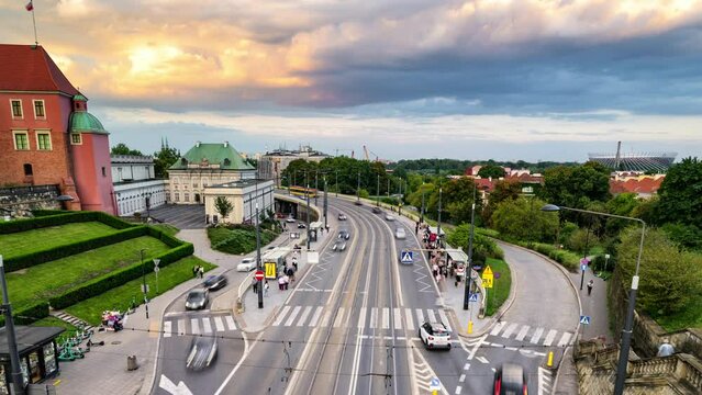 4K Time Lapse, floating clouds at sunset over traf ic on a streen in historical center of Warsaw, Poland