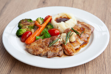 Chicken steak with mashed potatoes and grilled vegetable