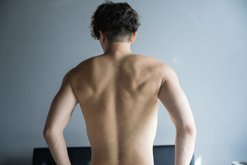 Beautiful back view of a man with a well-trained muscular back back