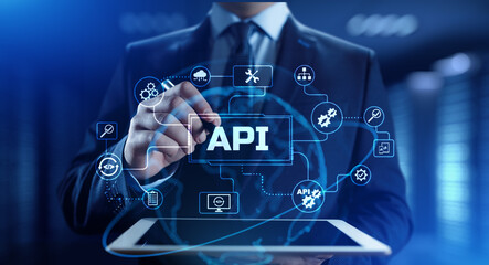 API Application programming interface. Businessman pressing virtual button.