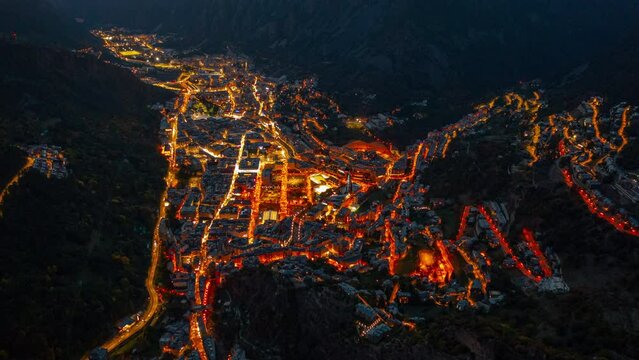 Night aerial hyperlapse (time lapse) of Andorra La Vella with car traffic lights