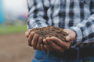 Symbol heart earth day. Handful of dirt hands heart shape. Farm organic earth. Farmer hands soil ground earth dirt garden soil farm ground. Male hands full of fertile land field agriculture concept