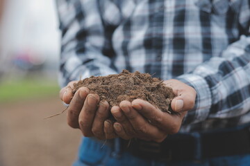 Symbol heart earth day. Handful of dirt hands heart shape. Farm organic earth. Farmer hands soil...
