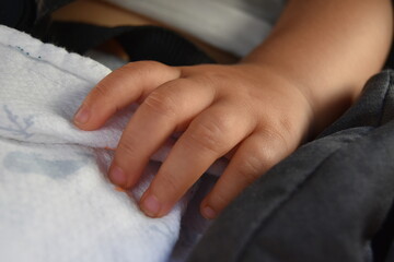 Fototapeta premium close up of a sleeping baby's hand