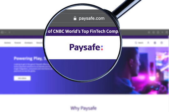 Kyiv, Ukraine - September 4, 2023: Paysafe company logo on laptop screen seen through an optical prism, creative interpretation. Dynamic and unique image from Paysafe website. Illustrative editorial.