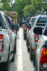 Traffic is jammed with lumber trucks and pants lined the streets of Bangkok. Annually an estimated...