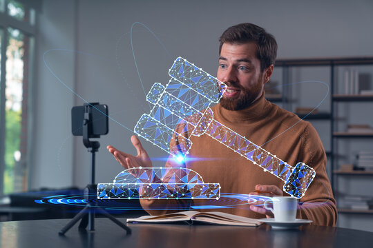 Happy man is making video blog using smartphone on a tripod explaining, teaching, master class people in room. Concept of online stream, business education, conference call. Legal and law icons