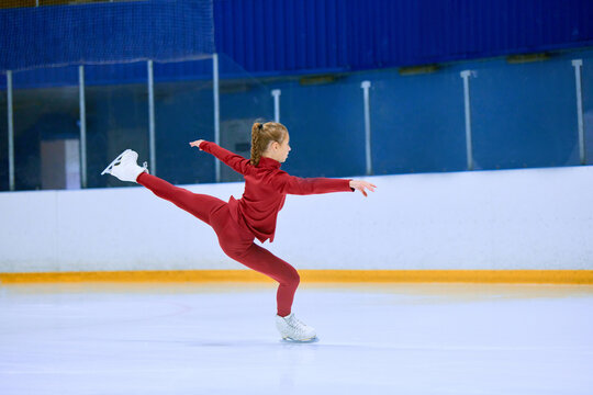Teen girl, figure skating athlete in motion during training session on ice rink arena. Learning and growing skills. Concept of professional sport, competition, sport school, health, hobby, ad - Powered by Adobe