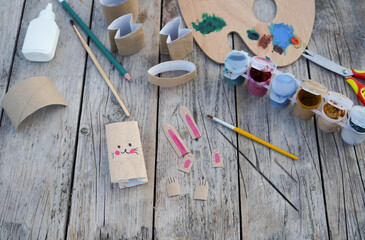 Kids craft bunnies out of recycling toilet paper roll, zero waste concept. Step by step instruction - 5