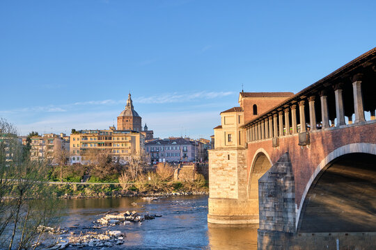 Pavia, Italy April 2023. Ponte Coperto (covered bridge) or the Ponte Vecchio a stone arch bridge over the Ticino River.