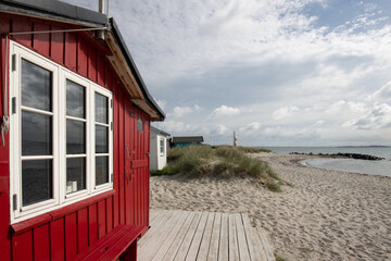 Traditional red colored beach hut in Eriks Hale, Marstal, Ærø, Denmark. - obrazy, fototapety, plakaty