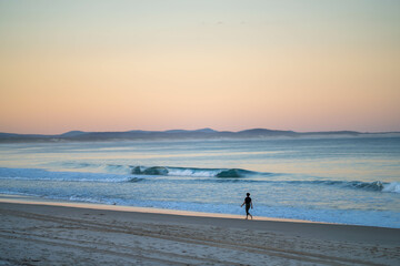 Fototapeta na wymiar walking on a beach on winter in australia. beautiful beach landscape in america