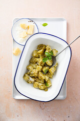 Traditional potato gnocchi with pesto sauce