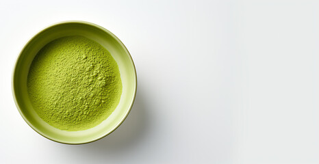 A top-down view reveals an exquisite minimalist food photograph featuring green matcha tea, elegantly presented in a wooden bowl with copyspace