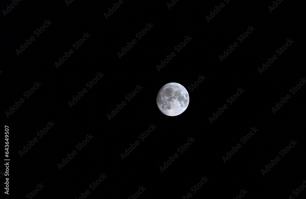 Wall mural view of the full moon at the time of the blue full moon on august 29, 2023, the second full moon of 