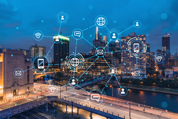 Aerial panoramic cityscape of Philadelphia financial downtown at night time, Pennsylvania, USA. Glowing Social media icons. The concept of networking and establishing new connections between people