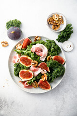 Healthy kale salad with figs and bacon