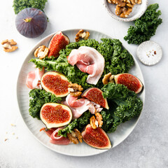 Healthy kale salad with figs and bacon