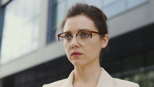 Anxious woman looking with offended face expression, upset that she received severe reprimand at work, humiliated and insulted by employees, enduring ridicule and bullying