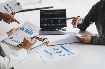 Meeting with business partners to discuss financial advisors to analyze market growth charts in...