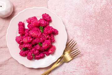 Beetroot Pasta, Barbie Themed Pasta. Pink noodles on pink background.