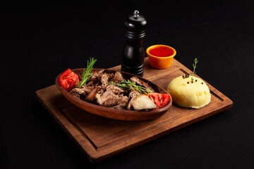 The chef-prepared main course meal consisting of meat, chicken, rice, potatoes, and pasta