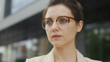 Serious and inspired female civil servant running for parliament, going to give a speech to the public, election campaign, faith to the better future