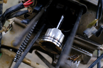 Check the motorcycle piston in the engine.