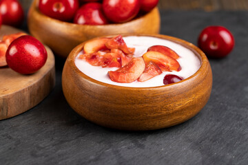 fresh yogurt with cherry flavor and whole juicy cherry berries