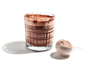 Glass of healthy chocolate milkshake smoothie with protein powder in measuring spoon isolated on...